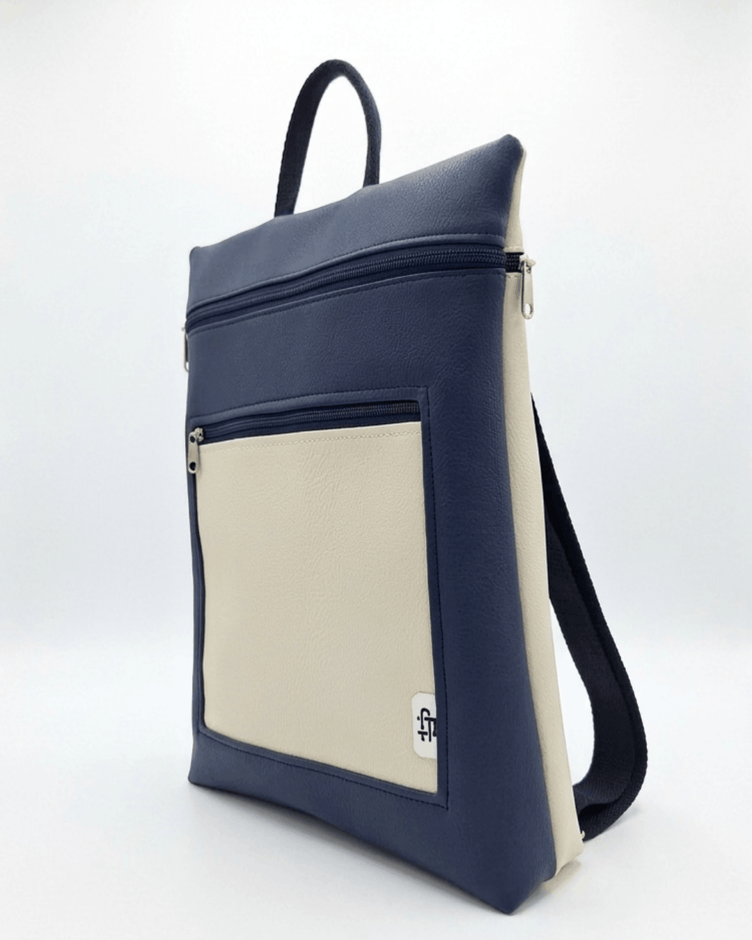 cristina-alba-mochila-mujer-antirrobo-reversible-129-crema-azul-marino
